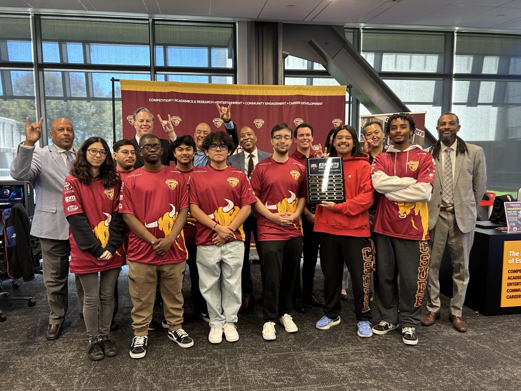 CSUDH's Overwatch2 winning team with the campus president and other administrators.